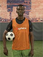 Akintunde Oyedeji holding a soccer ball on the Pitch 25 field