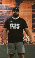 Isaias Solano in a P25 shirt holding a soccer ball